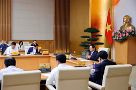 越南政府总理范明政就实施对美贸易平衡和可持续发展问题召开了会议。图自越通社