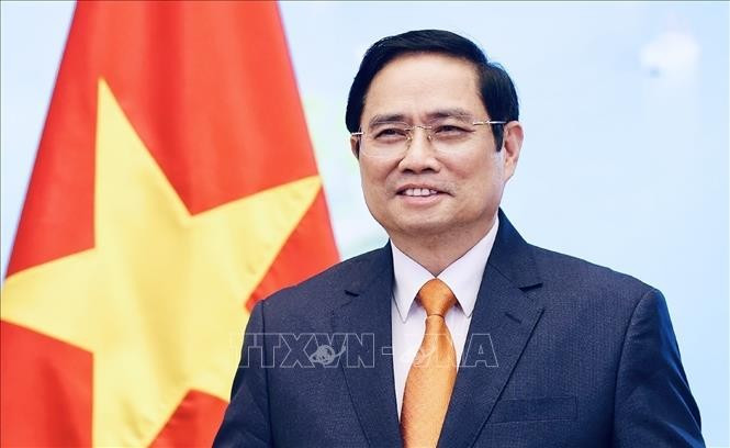 政府总理范明政。图自越通社