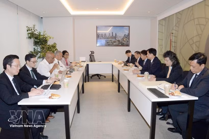 工作会谈现场。图自越通社