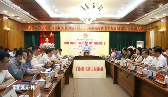 北宁省人民委员会主席王国俊在会上发言。图自越通社