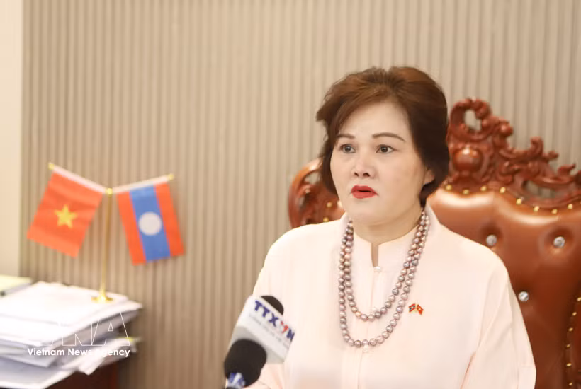 范氏明红女士接受越通社记者采访。图自越通社