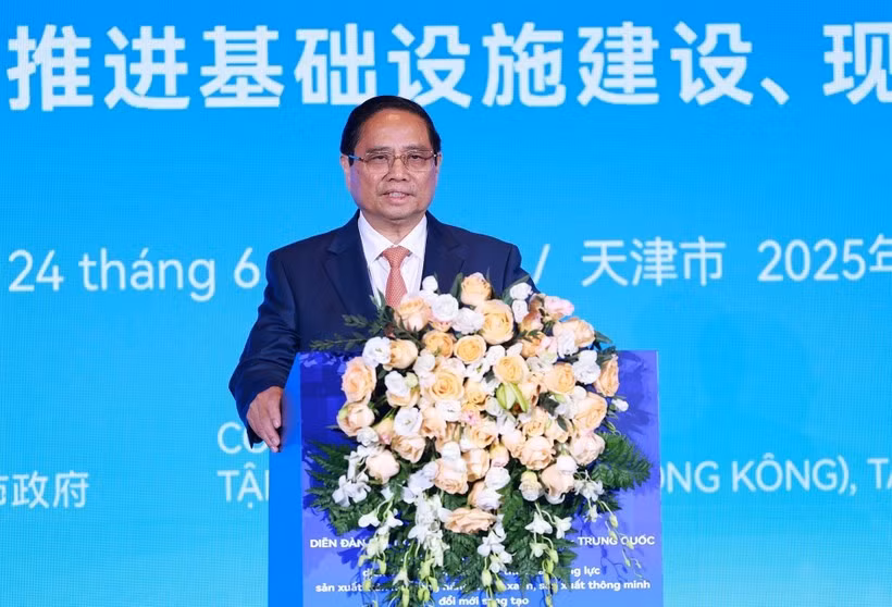 范明政总理在越南-中国企业论坛上发表讲话。图自越通社