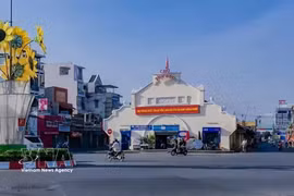 胡志明市守德坊是全国首个通过公布“幸福坊”标准体系。图自越通社