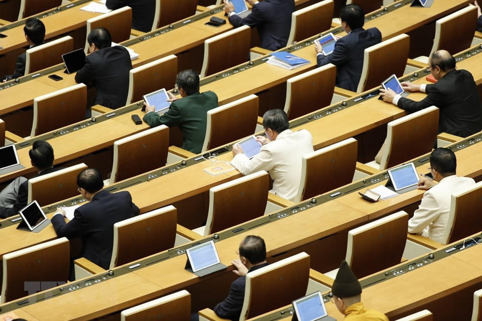越南国会代表出席第十四届国会第九次会议。图自越通社