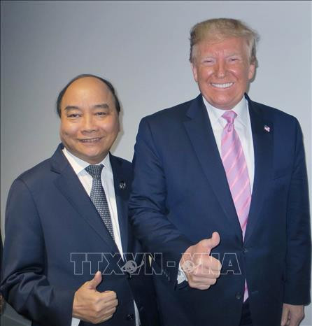 越南政府总理阮春福与美国总统特朗普。越通社记者 统一 摄