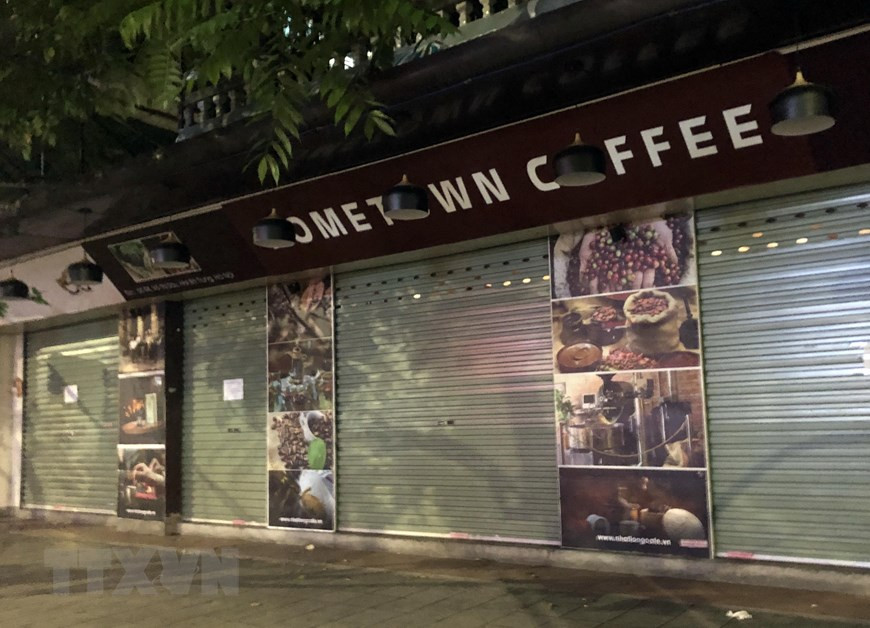 在被誉为“河内咖啡街”的武氏六街，许多咖啡店已经关门谢客。越通社记者 陈越 摄