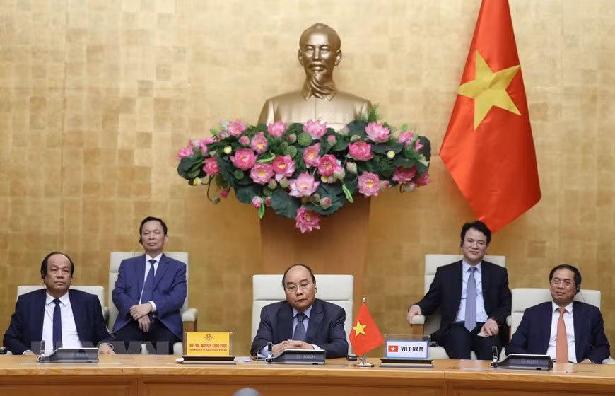 阮春福强调，为有效控制疫情，各国应加强信息交换和经验分享，互相提供检测技术支持，呼吁民众积极参与防疫工作。图自越通社