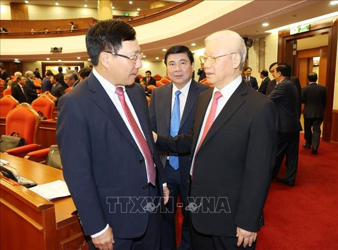 阮富仲与政府副总理兼外交部长范平明。越通社记者 智勇 摄