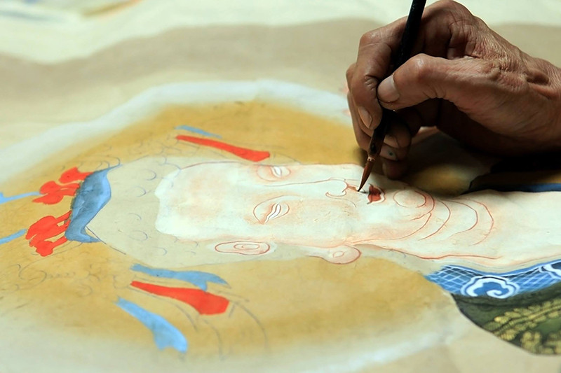 鼓街画更注重印刷之后的绘画环节，这一点与其他民间画是不同的。（图片来源：人民报）