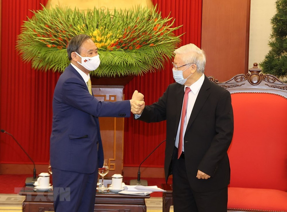 越共中央总书记、国家主席阮富仲会见日本首相菅义伟。越通社记者智勇摄