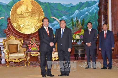  12 月 25 日在老挝首都万象，越共中央政治局委员、越南公安部部长陈大光大将一行已礼节性拜会了老挝人民革命党中央总书记、国家主席朱马里·赛雅颂。（图片来源：越通社）