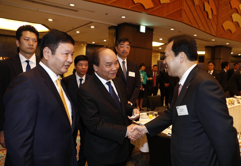越南政府总理阮春福会见日本信息技术企业领导代表。（图片来源：越通社）