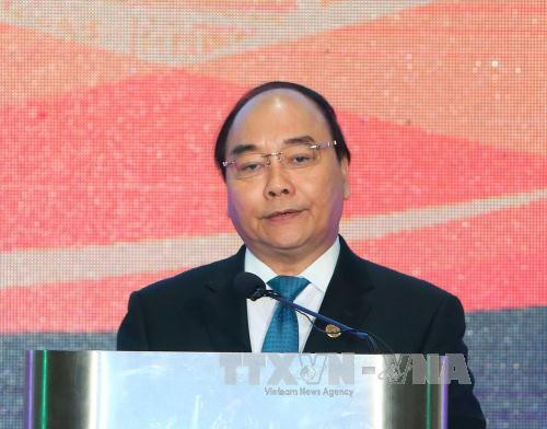 阮春福在宴会上致辞（图片来源：越通社）