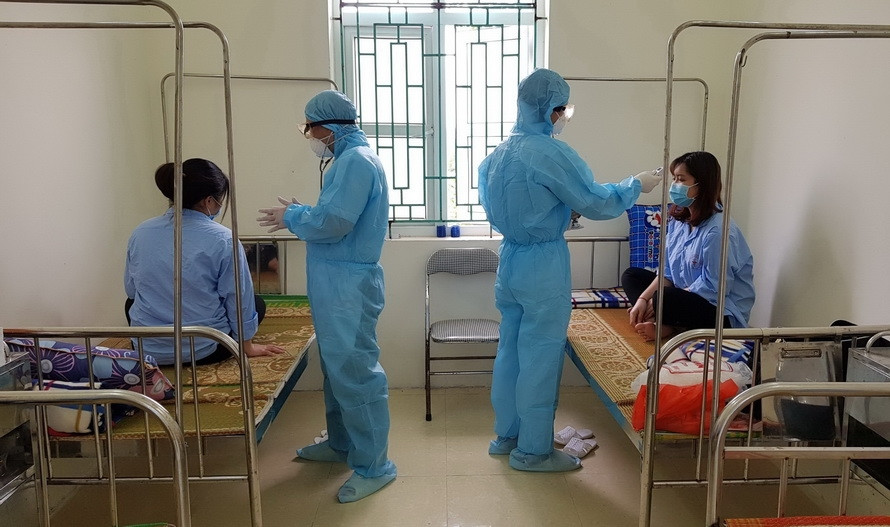 兴安省恩施县医疗中心对从韩国首尔归来的5名留学生进行隔离。越通社记者 丁俊 摄