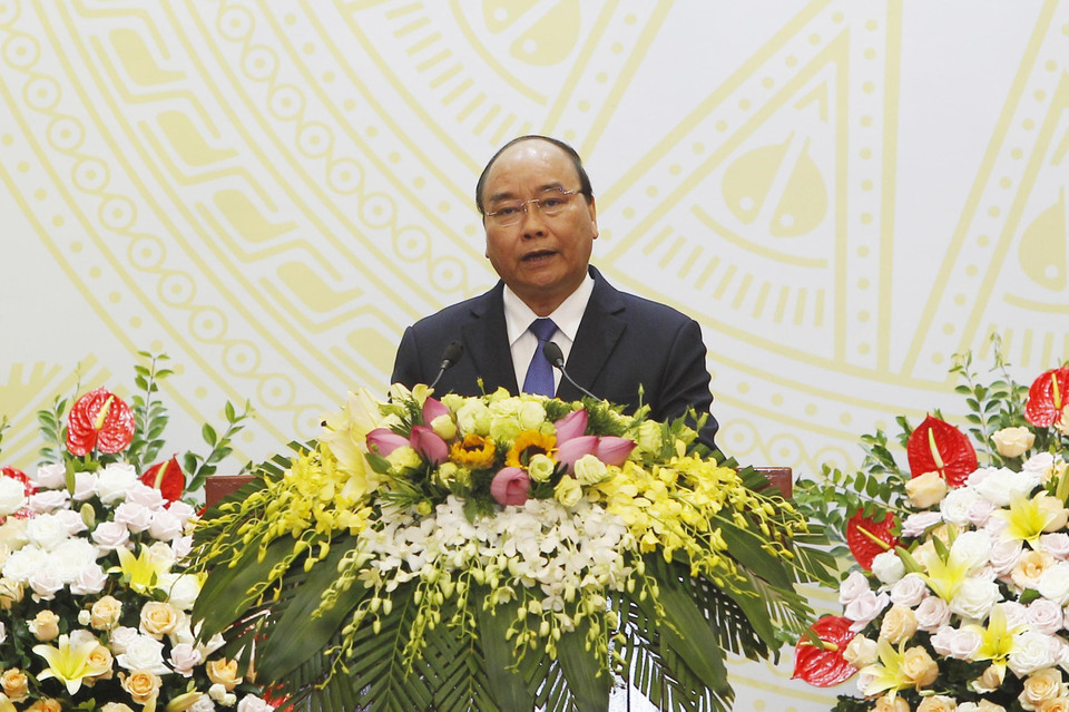 阮春福总理在招待会上发表讲话。图自越通社 