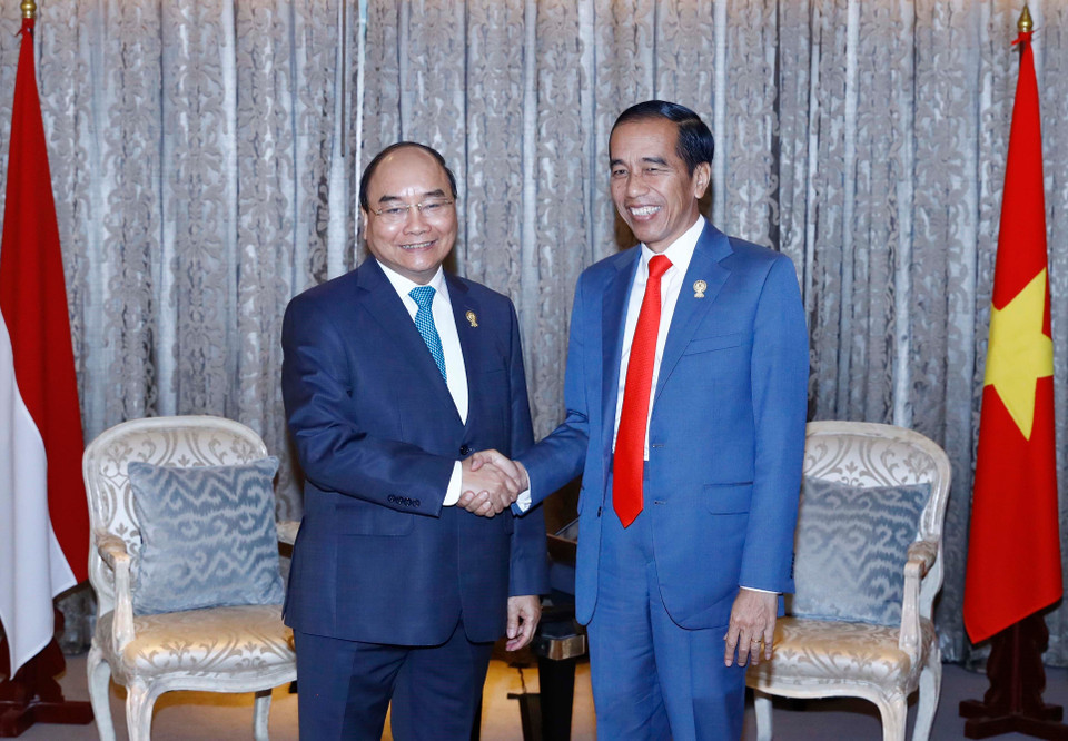 阮春福与印尼总统佐科握手。越通社记者 统一 摄