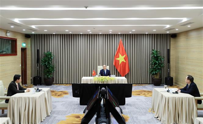  阮春福认为，现在比任何时候各国应加强团结一心，各国也要制定疫情得到控制后的发展计划，协助企业复工复产，保障和改善社会民生。越通折记者 黄统一 摄