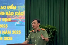 胡志明市公安局经济安全处副处长黎明宣上校在会上发表讲话。图自越通社