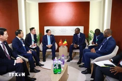 政府总理范明政会见塞内加尔总理 奥斯曼·松科。图自越通社