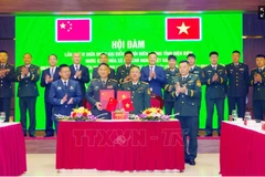 双方合作备忘录签署仪式。图自越通社