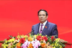 政府总理范明政。图自越通社