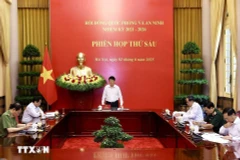 越南国家主席、国防与安全委员会主席梁强在会上发表讲话。图自越通社