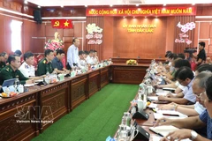 工作会谈场景。图自越通社