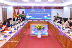 工作会谈场景。图自越通社