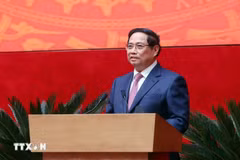 越南政府总理范明政发表讲话。图自越通社