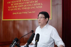 国家主席梁强在会上发表讲话。图自越通社