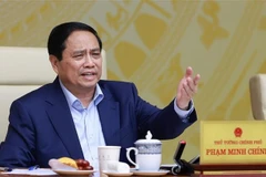 范明政主持召开2025年经济增长情景全国视频会议。图自越通社