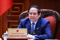 越南政府总理范明政主持召开与CT集团领导的工作会议。图自越通社