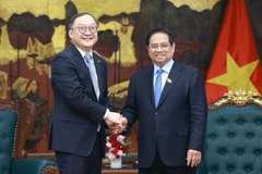 越南政府总理范明政会见了中国电力建设集团亚太地区事务董事长周嘉义。图自越通社