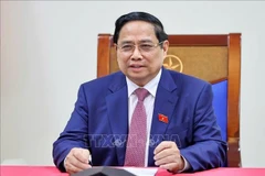 范明政总理与俄罗斯国家原子能集团公司总经理通电话。图自越通社