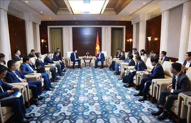 范明政总理与中国华设设计集团股份有限公司董事长杨卫东举行工作会谈。图自越通社 duong-ve-dong.jpg