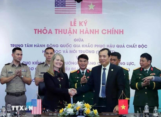 签字仪式。图自越通社 hoa-ky.jpg