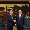 越南政府常务副总理范家足会见老挝农业与环境部部长林坎·杜昂萨万。图自政府报