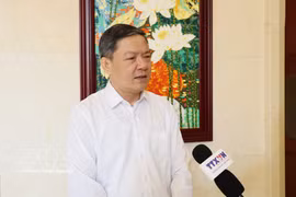 越南驻华大使馆商务参赞农德莱接受越通社驻北京记者的采访。图自越通社