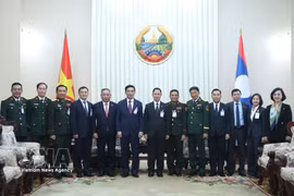 双方代表合影。图自越通社