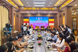 新闻发布会场景。图自越通社