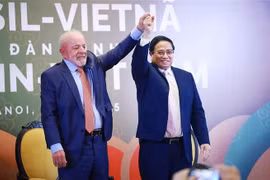 政府总理范明政和巴西总统卢拉出席越巴经济论坛。图自越通社
