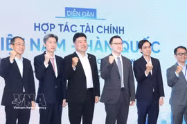 出席论坛的代表们。图自越通社