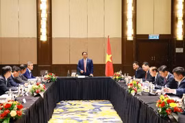 会议场景。图自越通社
