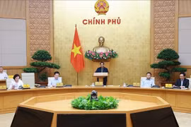 政府总理范明政主持召开会议。图自越通社