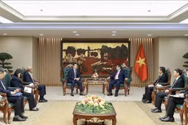 越南政府总理范明政会见世界知识产权组织总干事邓鸿森。图自越通社