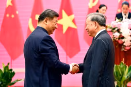 越共中央总书记与中共中央总书记、国家主席习近平出席中越人民聚欢。图自 越通社