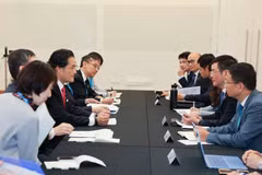 双方会晤现场。图自越通社