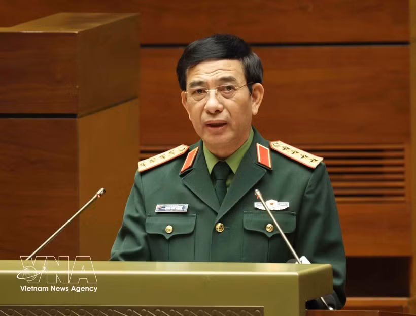 中央政治局委员、中央军委副书记、国防部长潘文江大将在会议上作报告。图自越通社