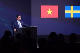  政府总理范明政在论坛上发言。图自越通社