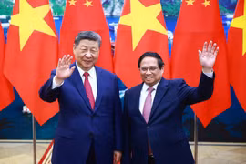 越南政府总理范明政会见中共中央总书记、国家主席习近平。图自越通社